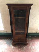 An antique style mahogany glazed cabinet fitted with two drawers