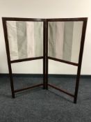 An Edwardian mahogany fire screen
