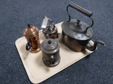 A tray of two antique copper kettles and two copper coffee pots