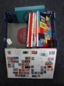 A basket containing nine assorted mid 20th century stamp albums with stamps including seven Royal