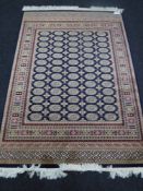 A Bokhara rug, 1.9m x 1.