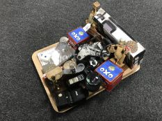 A tray of Egyptian style figures, paperweight, hip flask, camera lens,