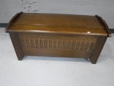 An oak linen fold blanket box