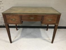 An antique military style desk fitted three drawers and tooled leather top
