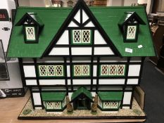 A large Tudor style dolls house