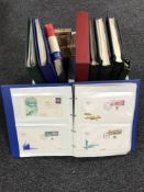 A box of stamp albums and covers.