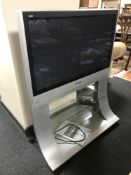 A Panasonic 37 inch plasma TV with remote on stand