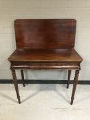 A 19th century mahogany foldover tea table