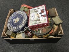 A box of vintage advertising tins