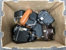 A box of vintage cameras