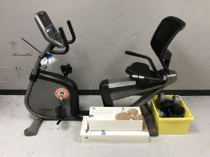 A Horizon fitness Elite R4000 exercise machine together with body and thigh shape exerciser,