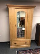 A 19th century pine mirror door wardrobe