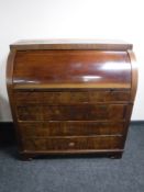 A late 19th century barrel fronted bureau
