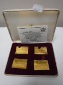 A cased set of four silver-gilt Railway Anniversary Stamps, issue No.