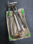 A box of antique stirrup pumps