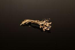 A 9ct gold sapphire floral spray brooch CONDITION REPORT: 2.