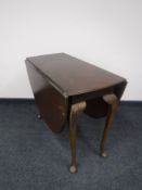 A mahogany gate leg table on club feet