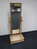 A pine cheval mirror fitted a drawer