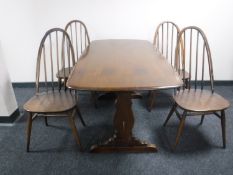 An Ercol refectory table and four chairs