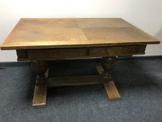 An oak refectory library table fitted two drawers