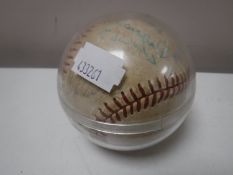 A signed baseball in protective case