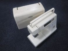 A Janome Memory Craft 5000 electric sewing machine in case (no pedal or lead)