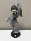 A Lladro figure of a geisha with fan