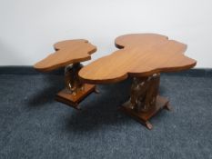 Two mahogany coffee tables on elephant pedestals