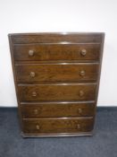 An oak five drawer chest