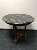 A 19th century circular mahogany and walnut marble topped centre table (restored)