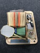 A tray containing wooden trinket boxes, costume jewellery, enamelled badges, pearls,