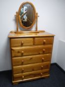 A contemporary pine six drawer chest and dressing mirror