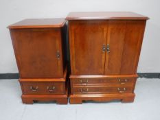 An inlaid yew wood TV and matching audio cabinet