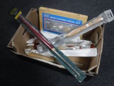 A box containing an eight-piece carving chisel set together with assorted chisels