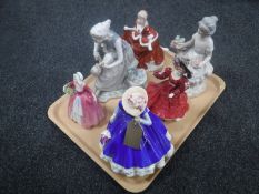 A tray of six figures; three Royal Doulton ladies,