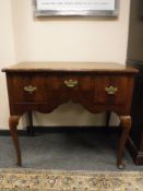 A George III walnut low boy,