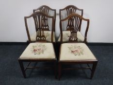 Four antique oak dining chairs on claw and ball feet and four other dining chairs