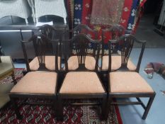 A set of six Hepplewhite style dining chairs