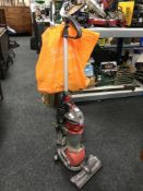A Dyson DC 24 upright vacuum cleaner