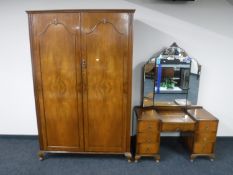 A walnut double door wardrobe and a kneehole dressing table