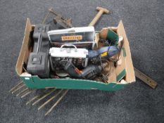 A box of assorted power tools,