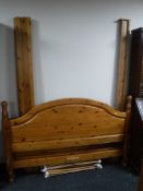 A contemporary pine 5' bed frame