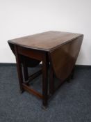 An Edwardian mahogany gate leg table
