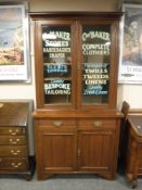 A Victorian and later mahogany bookcase with haberdashery decoration,