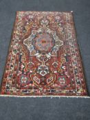 An antique Persian Bakhtiari rug 196 cm x 132 cm