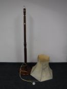 A mahogany standard lamp and shade
