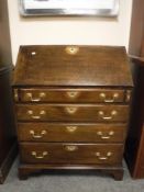A George III oak writing bureau,