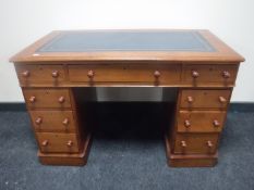 A Victorian mahogany child's writing desk fitted nine drawers