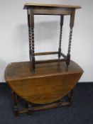 An oak gate leg table and an occasional table
