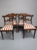 A set of four Regency style mahogany dining chairs